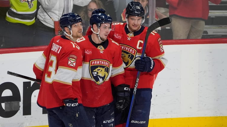 Florida Panthers right wing Vladimir Tarasenko (10) is congratulated by...