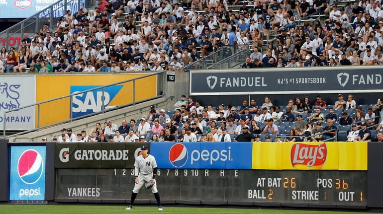 Aaron Judge #99 of the Yankees stands in the outfield during...