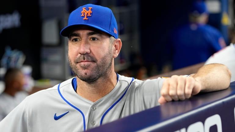 Justin Verlander looks on from the Mets dugout against the...