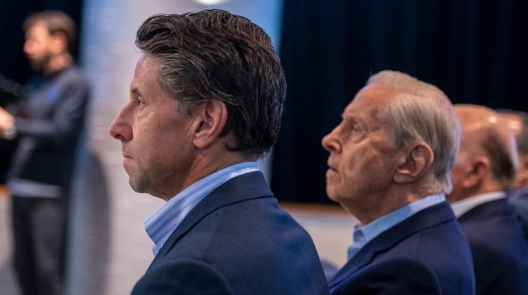 Mets COO Jeff Wilpon and co-owner Fred Wilpon listen to...