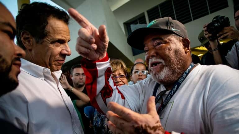 Gov. Andrew M. Cuomo speaks with a resident of Ponce...
