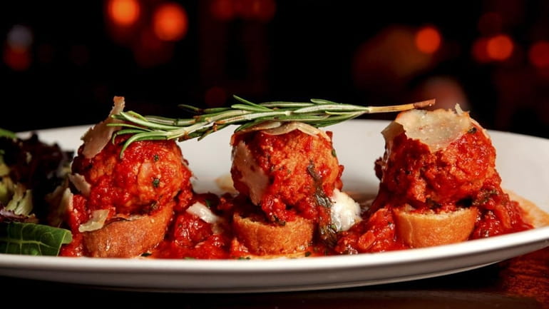 An appetizer of stuffed meatballs is served at Nick's Tuscan...