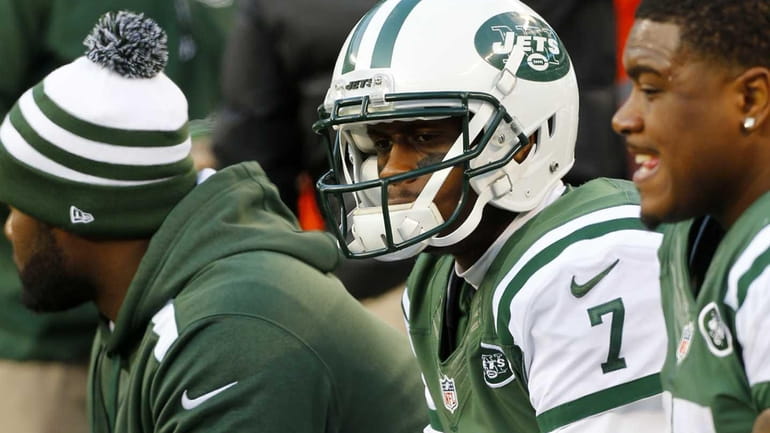 Jets quarterback Geno Smith sits on the bench during the...