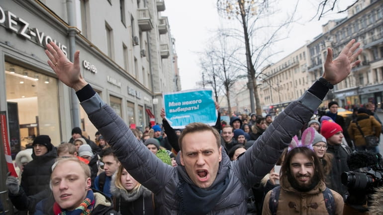 Russian opposition leader Alexei Navalny, center, at a rally in Moscow...