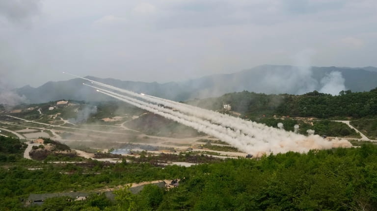 South Korean army's multiple launch rocket systems fire rockets during...