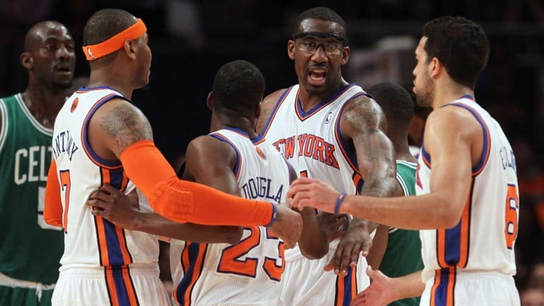 Amar'e Stoudemire #1 of the New York Knicks talks with...