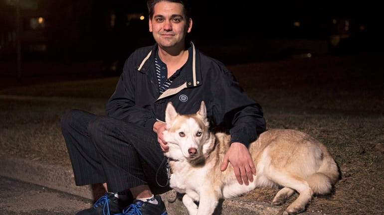 Thomas Pollicino, of Kings Park, with his emotional support dog,...