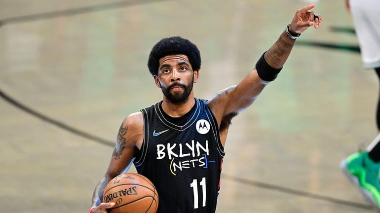 Kyrie Irving of the Nets acknowledges the fans prior to...