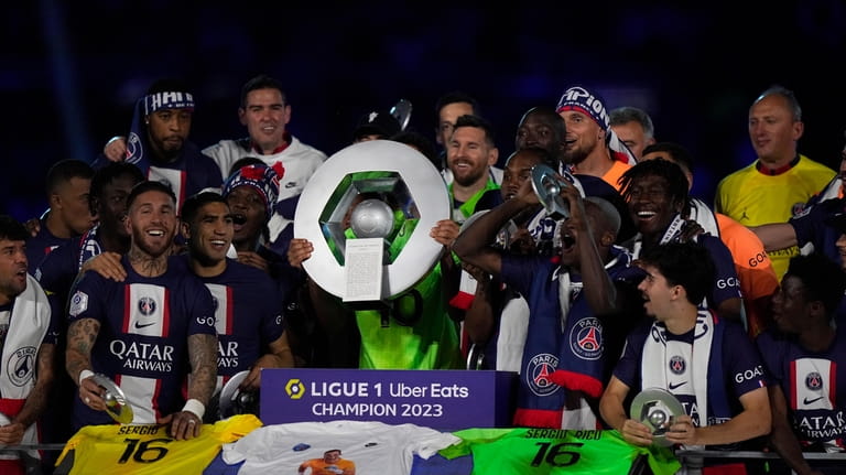 PSG players celebrate their title after the French League One...