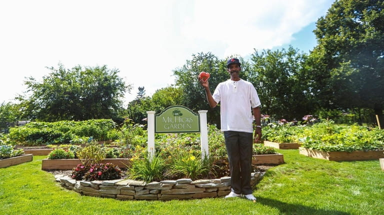 Theo Marks, a resident at Magnolia Gardens, holdsup his largest...