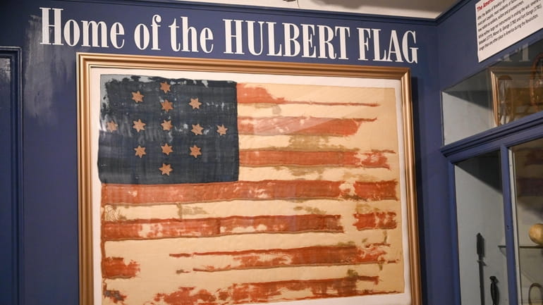 The Hulbert flag hangs on a wall at the Suffolk...