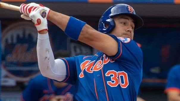 Mets outfielder Michael Conforto bats during a spring training game against...