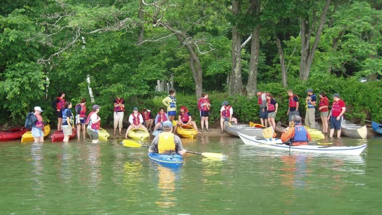 Visitors get ready to kayak at Fish Creek Pond Campground...