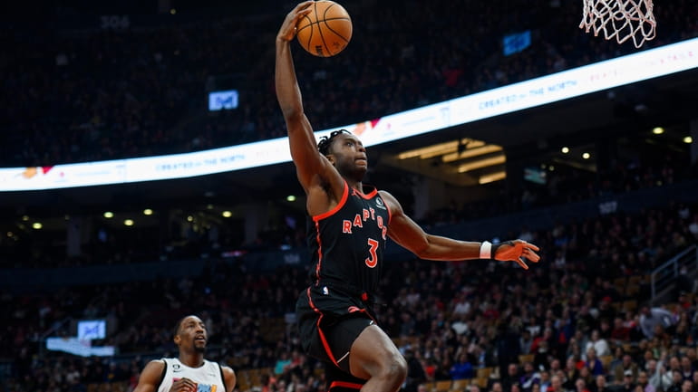 Toronto Raptors forward O.G. Anunoby goes up for a dunk...