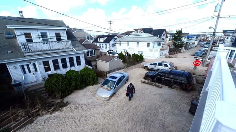 Damage caused by Superstorm Sandy is seen on the west...