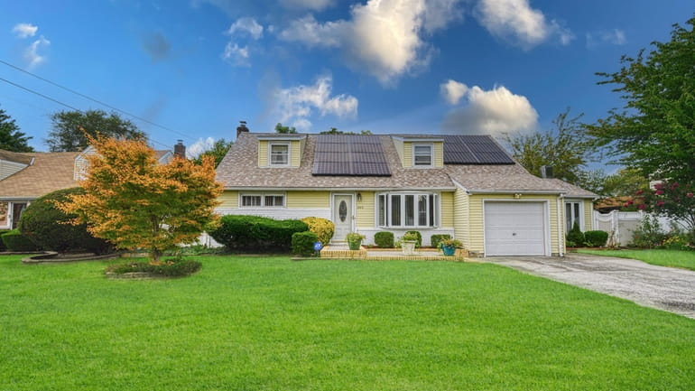 The four-bedroom, two-bath Cape has solar panels that are owned, not...