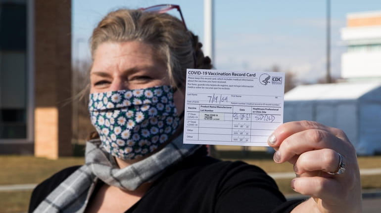 Elizabeth Brown of Southold shows her COVID-19 Vaccination Record Card...