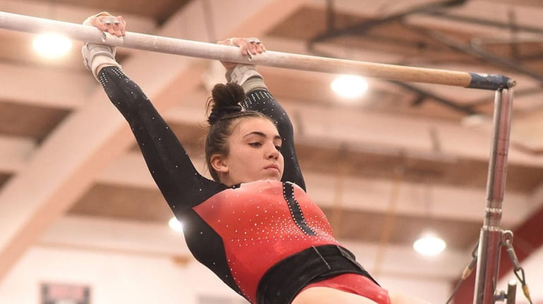 Alexandra Melchiona of Connetquot performs on the uneven bars during the...
