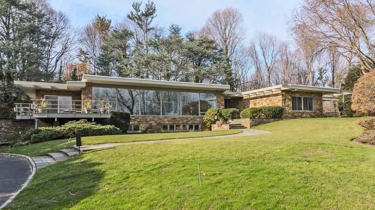 This Midcentury Modern Kings Point ranch has six bedrooms and...