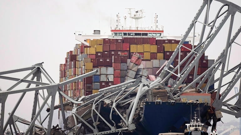 A cargo ship is stuck under the part of the...