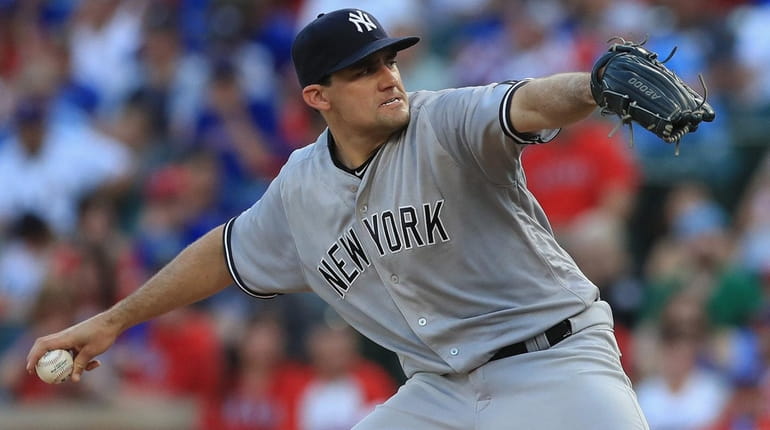 Nathan Eovaldi of the New York Yankees throws against the...