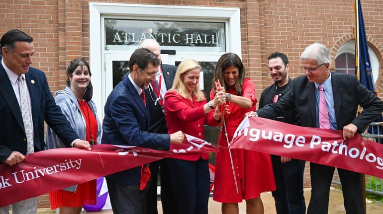 Officials at a ribbon-cutting ceremony on Friday at Atlantic Hall to...
