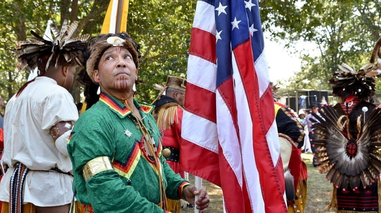 Keith Phillips, of the Shinnecock tribe, awaits the start of...