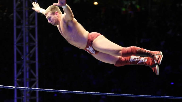 WWE Superstar Daniel Bryan flys off the ropes during the...