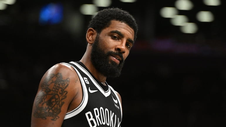 Nets guard Kyrie Irving looks on against the New Orleans...