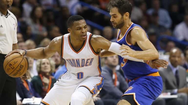 Oklahoma City Thunder guard Russell Westbrook (0) drives around New...