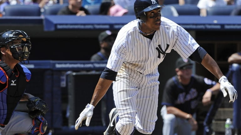 New York Yankees' Curtis Granderson watches his two-run home run...