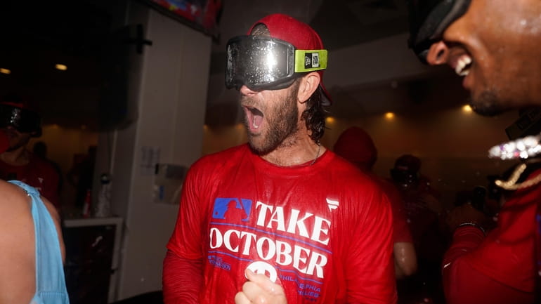 Philadelphia Phillies' Bryce Harper celebrates after winning a baseball game...
