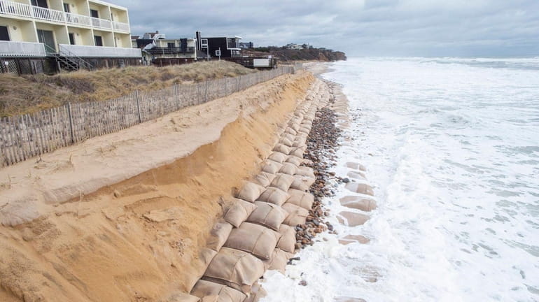 A view looking east shows erosion along the ocean beach...