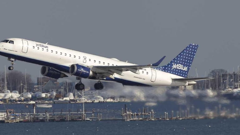 A JetBlue aircraft takes off at Boston's Logan International Airport....