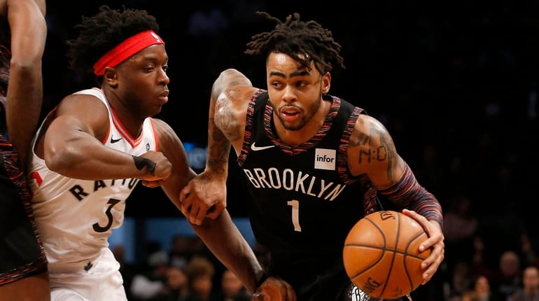 D'Angelo Russell #1 of the Brooklyn Nets drives against OG...
