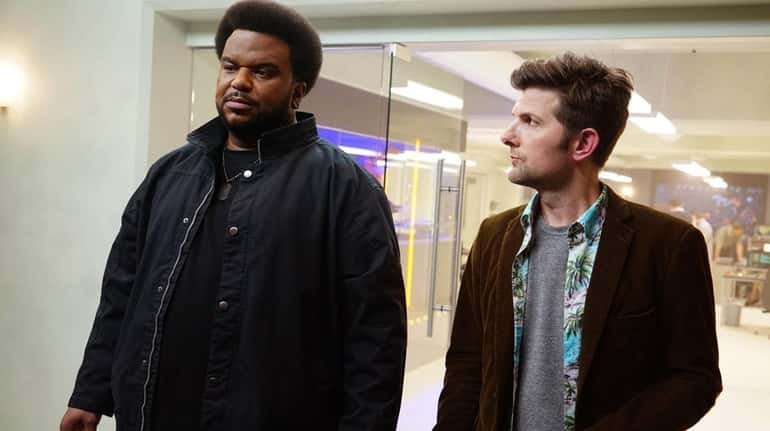 Craig Robinson, left, and Adam Scott are paranormal researchers on...