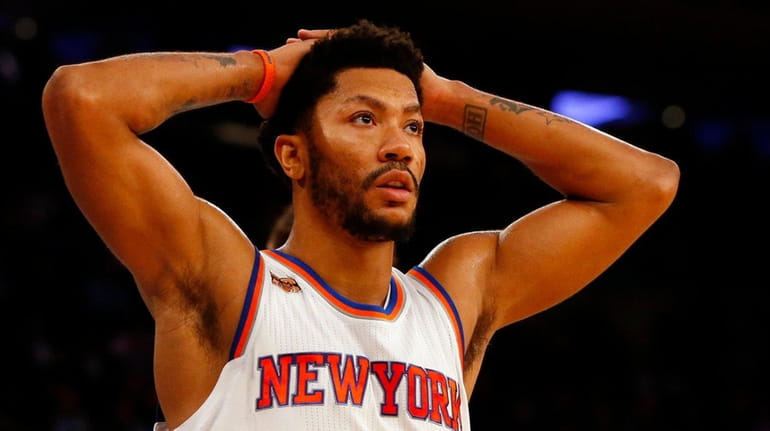 Derrick Rose #25 of the New York Knicks reacts to...