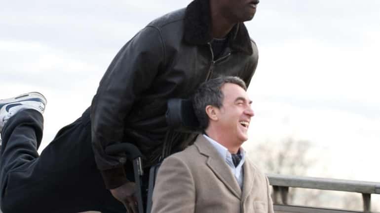 Omar Sy, left, as Driss and Francois Cluzet as Philippe...