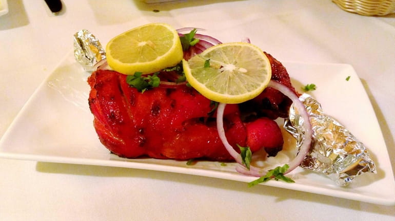 Tandoori chicken is one of the specialties at Tandoori Touch,...
