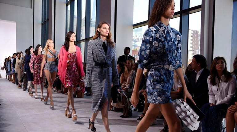 Models for Michael Kors walk the runway during New York...