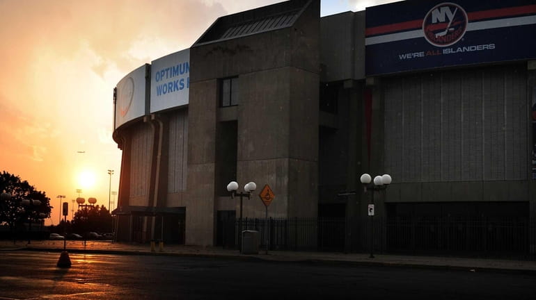 The sun sets behind the Nassau Coliseum in Uniondale. (August...