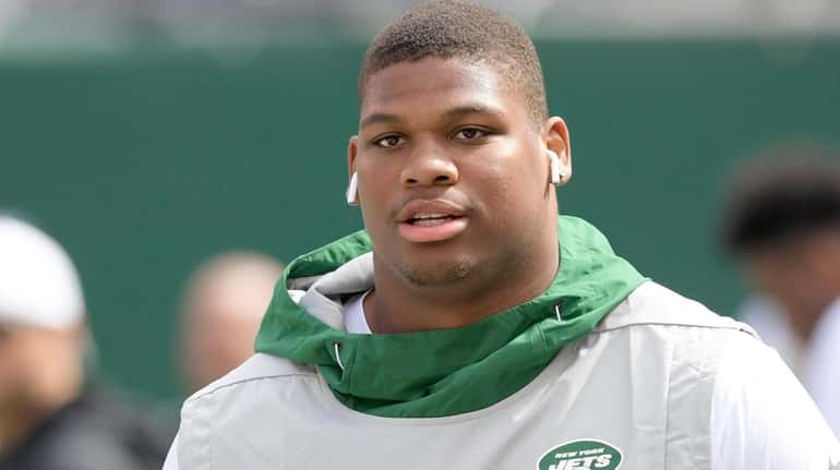New York Jets defensive tackle Quinnen Williams warms up before...