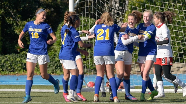 Olivia Cruthers of Kellenberg Memorial High School is congratulated by...