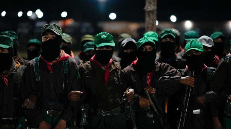 Members of the Zapatista National Liberation Army, EZLN, attend an...