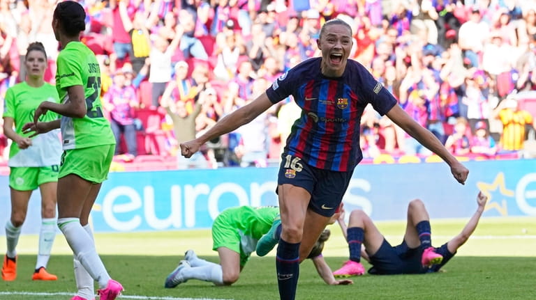 Barcelona's Fridolina Rolfo,center, celebrates after scoring her side's third goal...