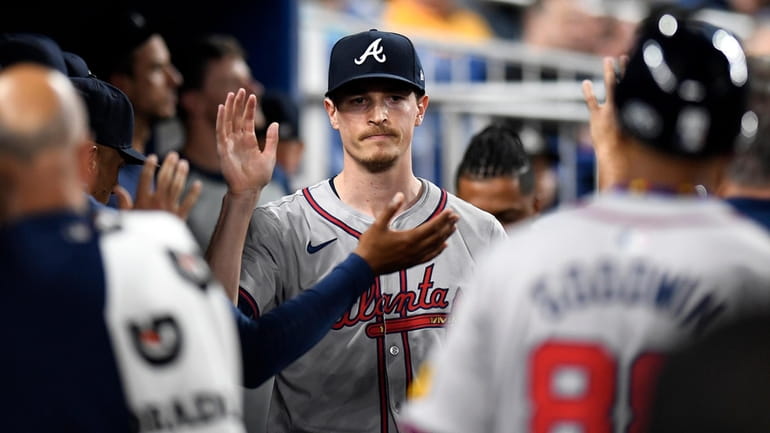 Atlanta Braves pitcher Max Fried is greeted after working in...