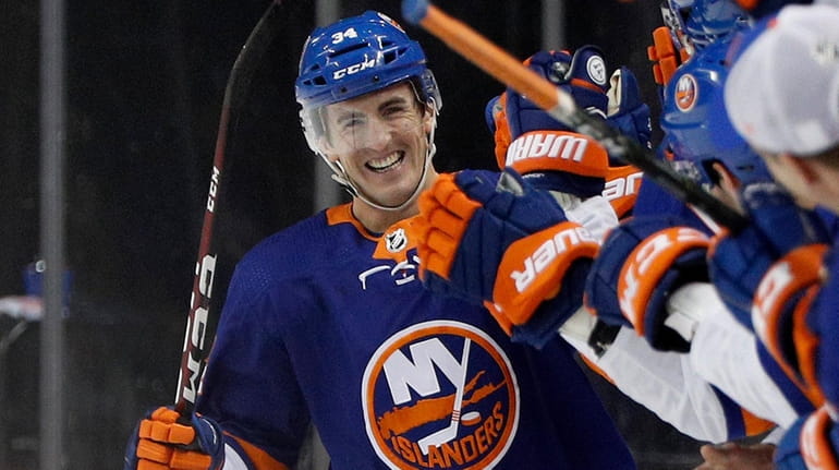 Cole Bardreau of the Islanders celebrates his second-period penalty-shot goal...