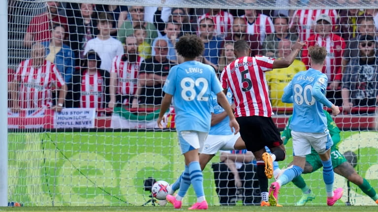 Brentford's Ethan Pinnock scores his side's opening goal during the...