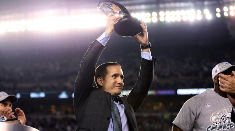 Eagles EVP of football operations Howie Roseman lifts the NFC...