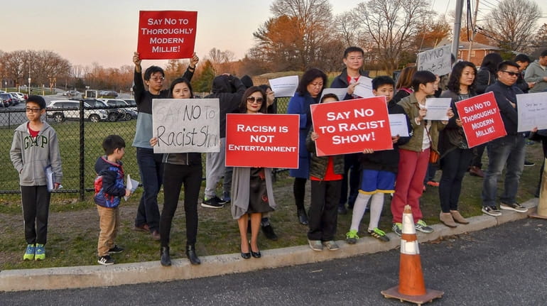 Protesters demonstrate against the musical "Thoroughly Modern Millie" outside Huntington...